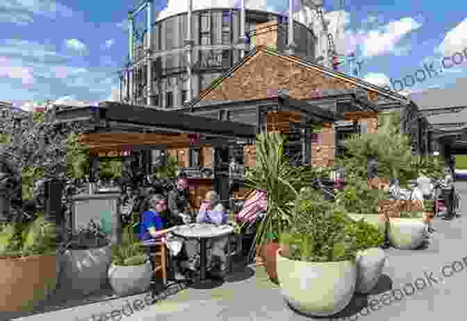 People Dining Outdoors At A Pub Next To A Canal, Surrounded By Greenery Narrowboat Dreams: A Journey North By England S Waterways